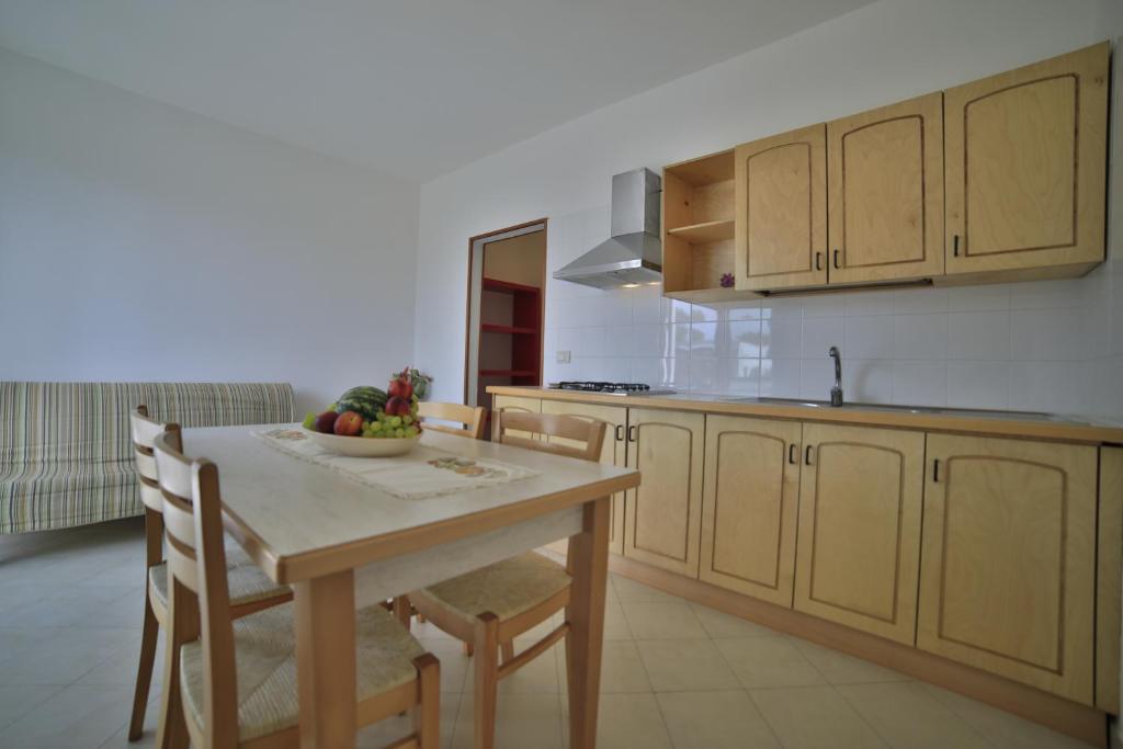 Kuchyň nebo kuchyňský kout v ubytování Residence Cala Verde