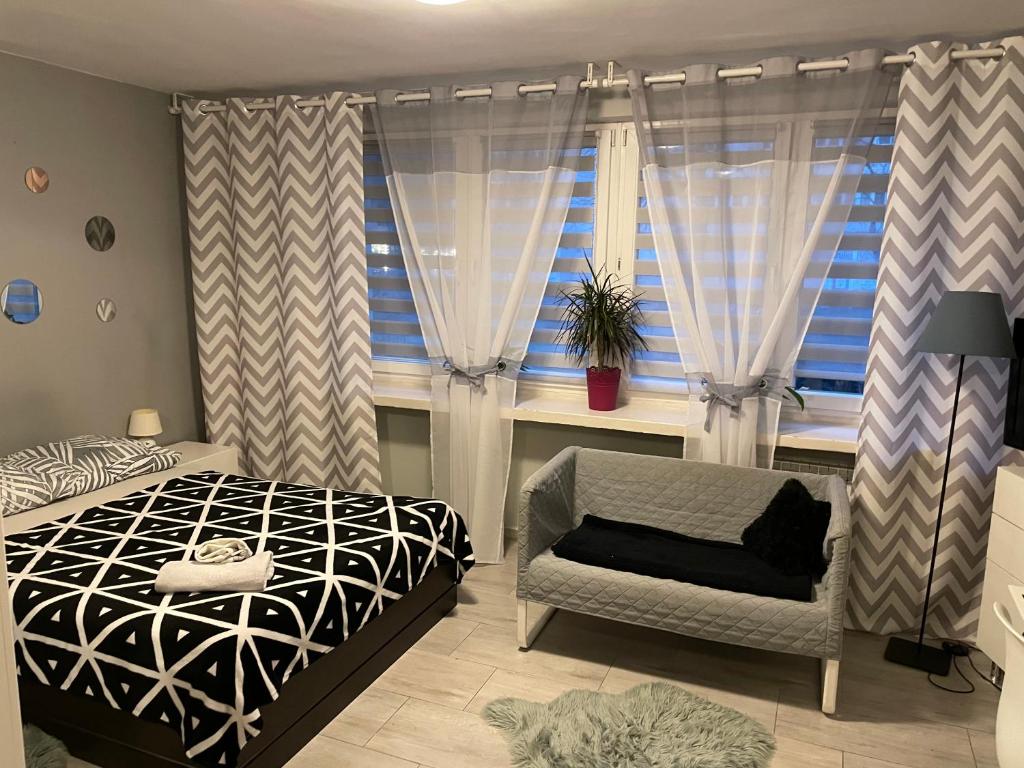 Posteľ alebo postele v izbe v ubytovaní Apartament Centrum Pańska