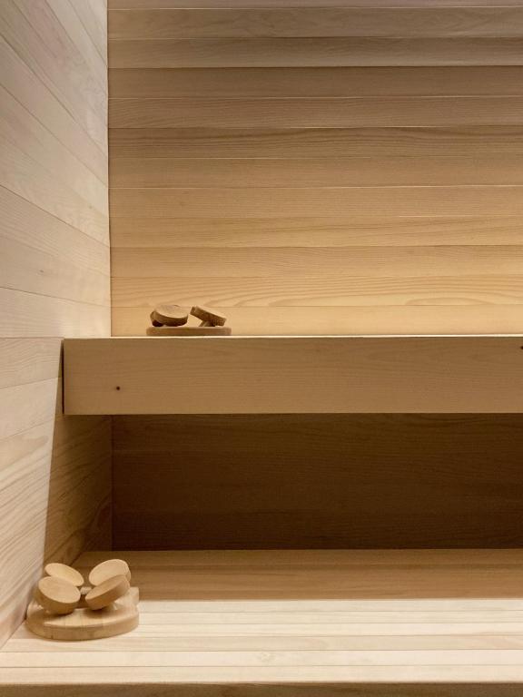 a bathroom with three toilets sitting on a shelf at Encanto Agriturismo & Private SPA in Visogliano