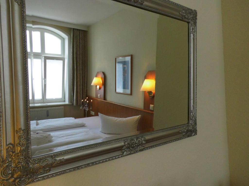 Postel nebo postele na pokoji v ubytování Marin Hotel Sylt GmbH