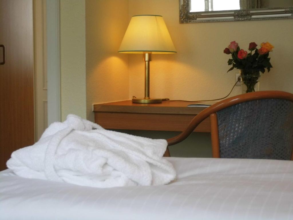 Postel nebo postele na pokoji v ubytování Marin Hotel Sylt GmbH