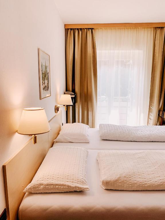 Postel nebo postele na pokoji v ubytování Hotel Markushof - Adults only