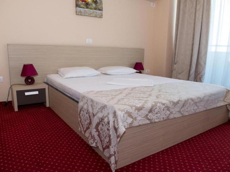 Postel nebo postele na pokoji v ubytování Hotel Romantic