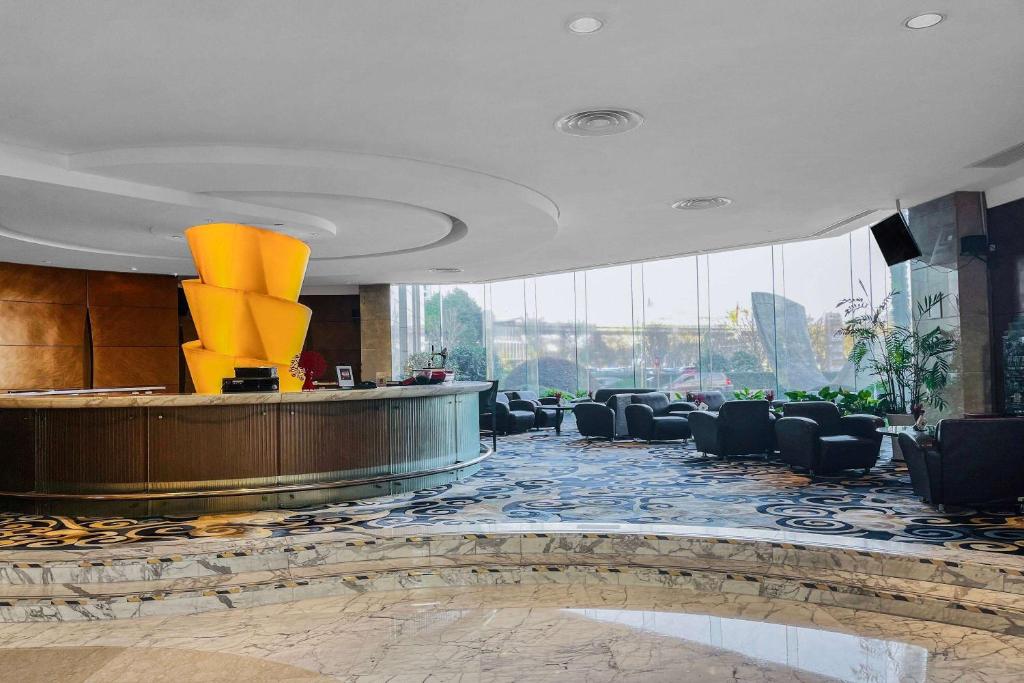 TV a/nebo společenská místnost v ubytování Ramada Plaza Pudong Shanghai