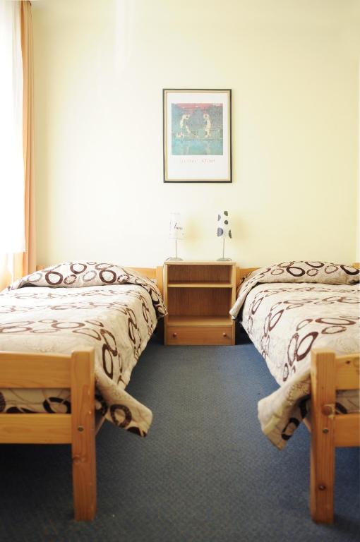 Postel nebo postele na pokoji v ubytování Amicus Hotel