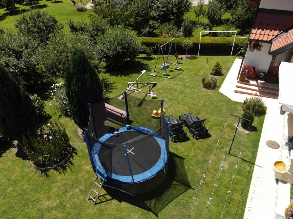 an aerial view of a backyard with a trampoline at Apartments Marjanović in Zlatibor