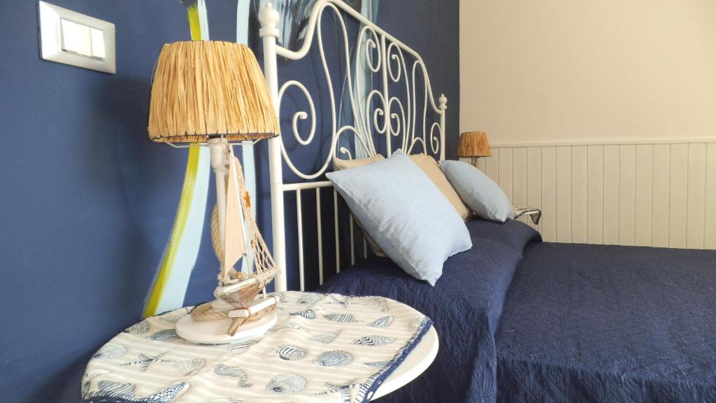 Postel nebo postele na pokoji v ubytování Holiday Rooms Ninfa