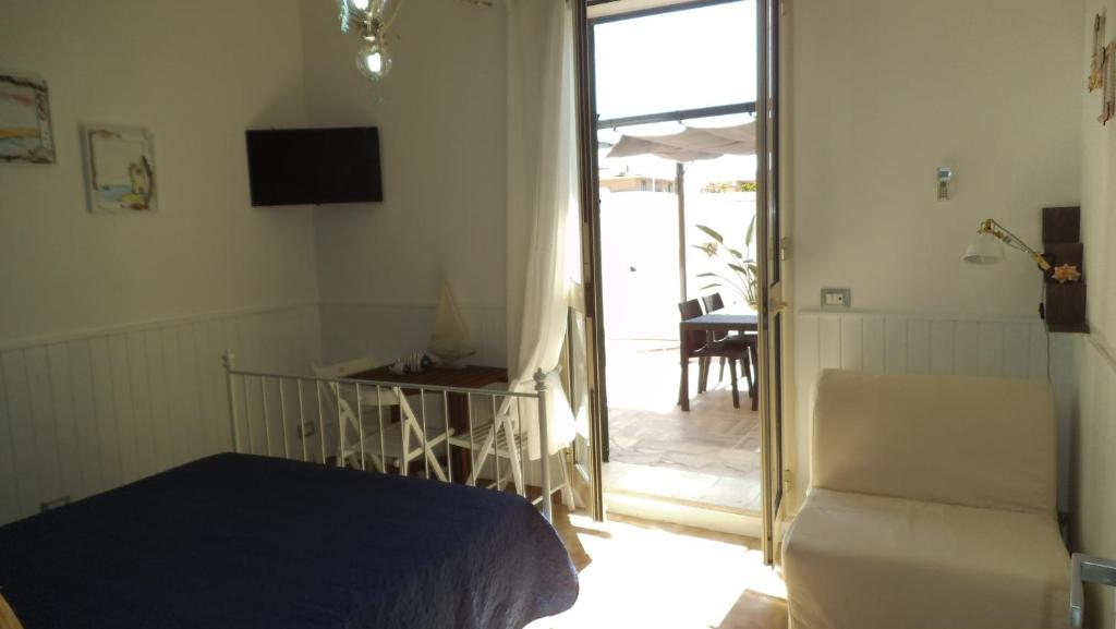 TV a/nebo společenská místnost v ubytování Holiday Rooms Ninfa