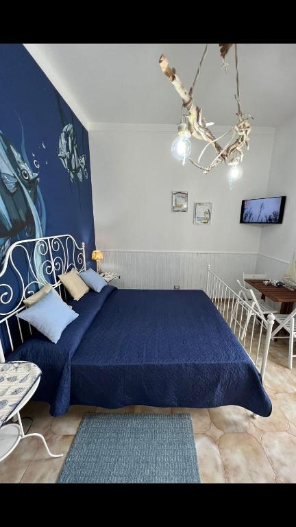 Postel nebo postele na pokoji v ubytování Holiday Rooms Ninfa