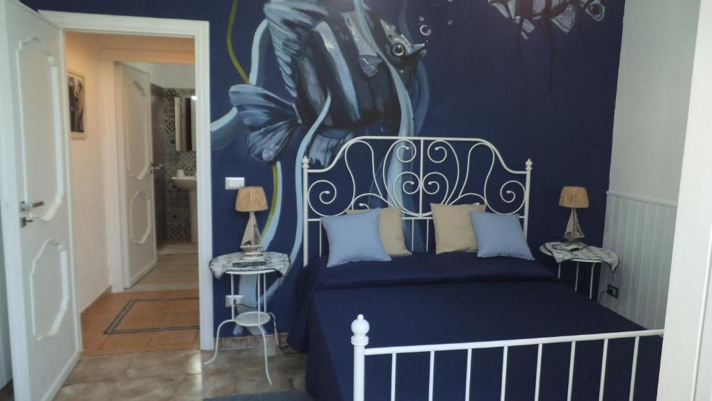 Postel nebo postele na pokoji v ubytování Holiday Rooms Ninfa