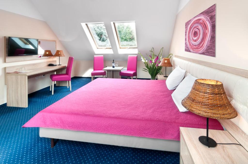 Posteľ alebo postele v izbe v ubytovaní Hotel Petrus
