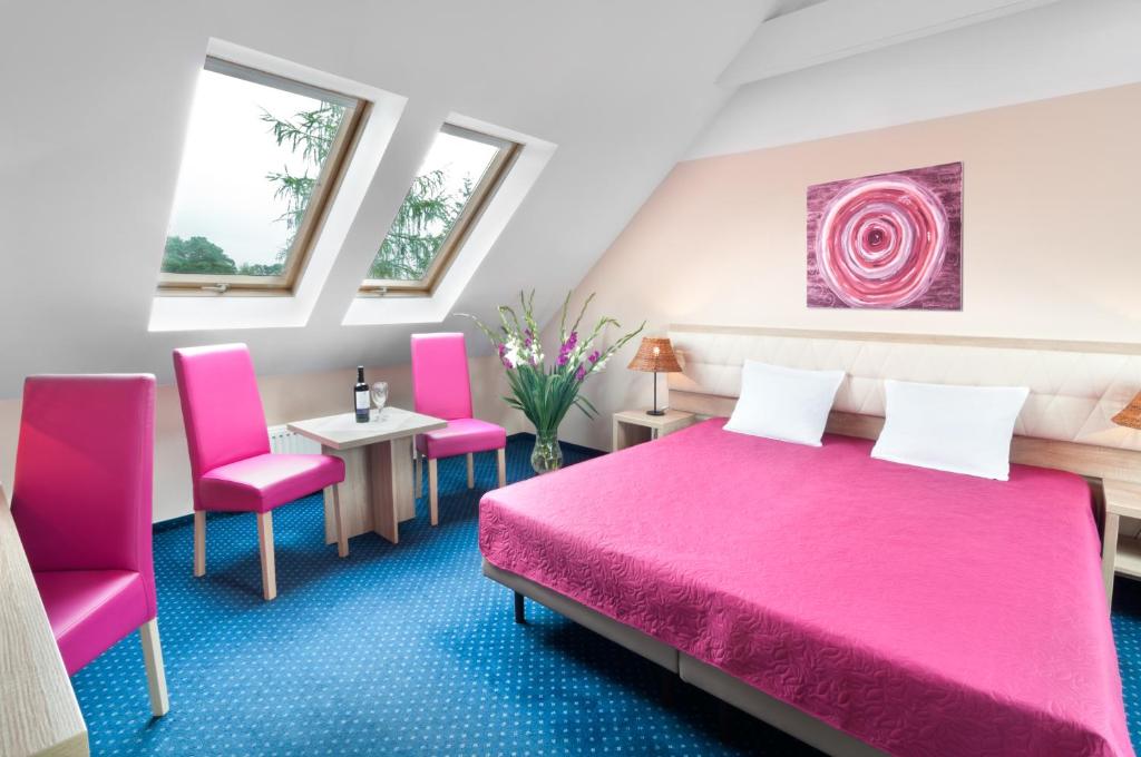 Posteľ alebo postele v izbe v ubytovaní Hotel Petrus