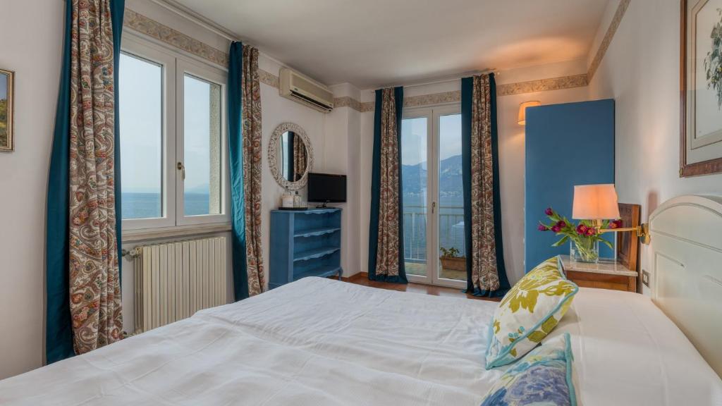 Postel nebo postele na pokoji v ubytování La Caletta Hotel Bolognese
