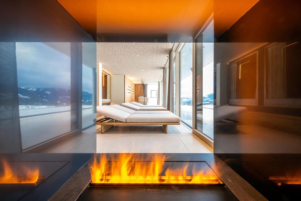 A bed or beds in a room at Hotel Ennstalerhof