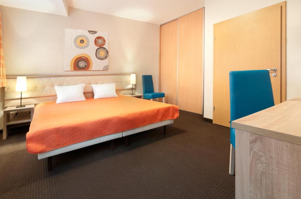 Posteľ alebo postele v izbe v ubytovaní Hotel Petrus