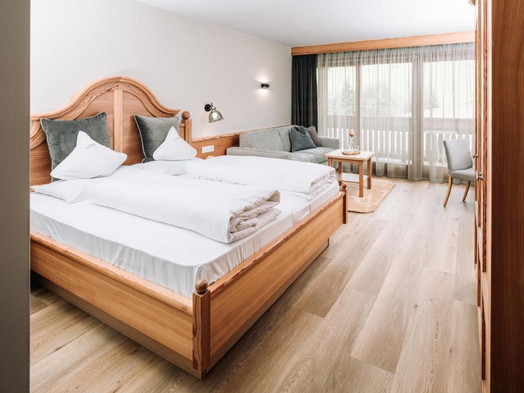 Postel nebo postele na pokoji v ubytování Hotel Bacherhof