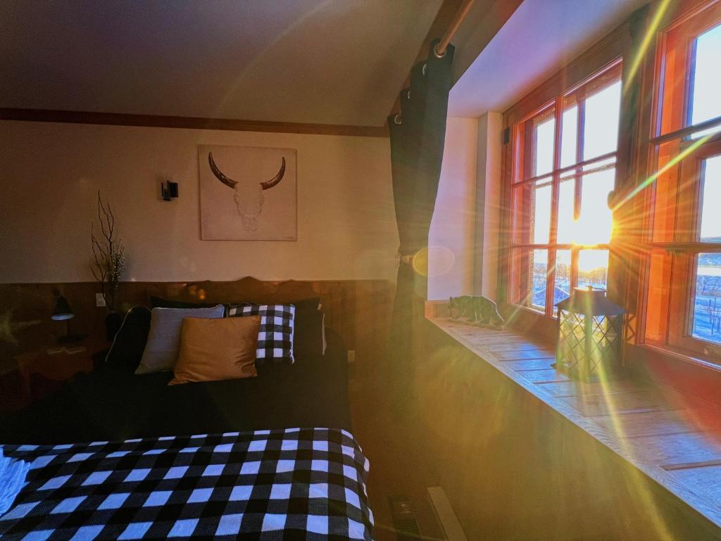 Postel nebo postele na pokoji v ubytování Auberge au Poste de Traite