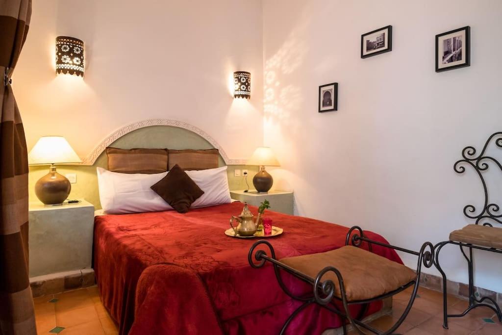 Postel nebo postele na pokoji v ubytování Riad Al Tainam