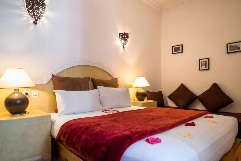 Postel nebo postele na pokoji v ubytování Riad Al Tainam