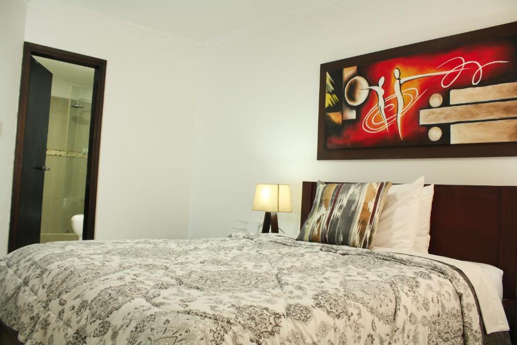 Postel nebo postele na pokoji v ubytování Apartahotel Kelly