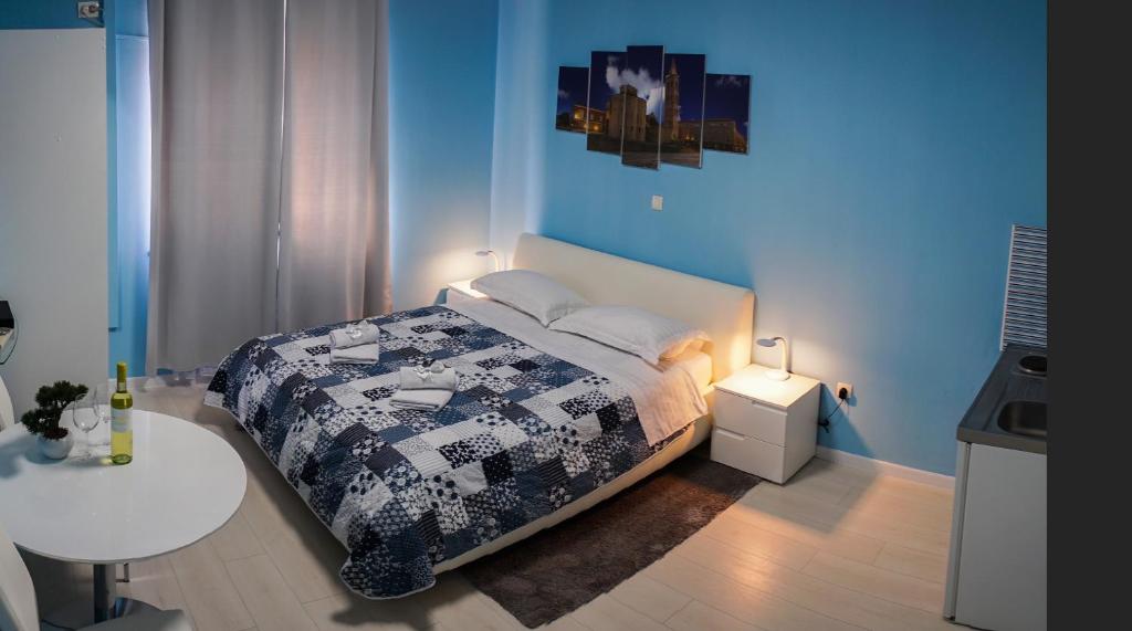 Postel nebo postele na pokoji v ubytování Apartments & Rooms Andrea 2