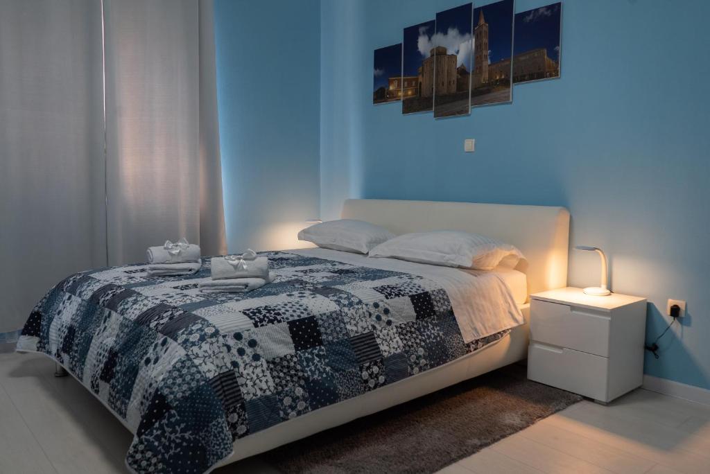Postel nebo postele na pokoji v ubytování Apartments & Rooms Andrea 2