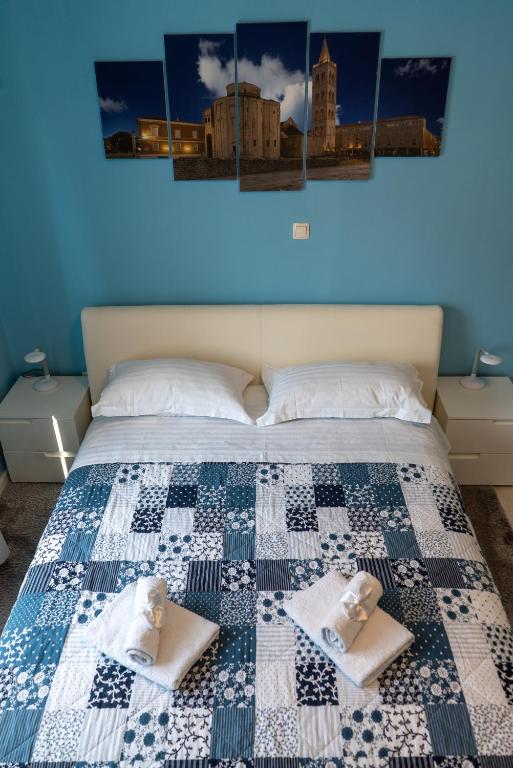 Postel nebo postele na pokoji v ubytování Apartments & Rooms Andrea 2