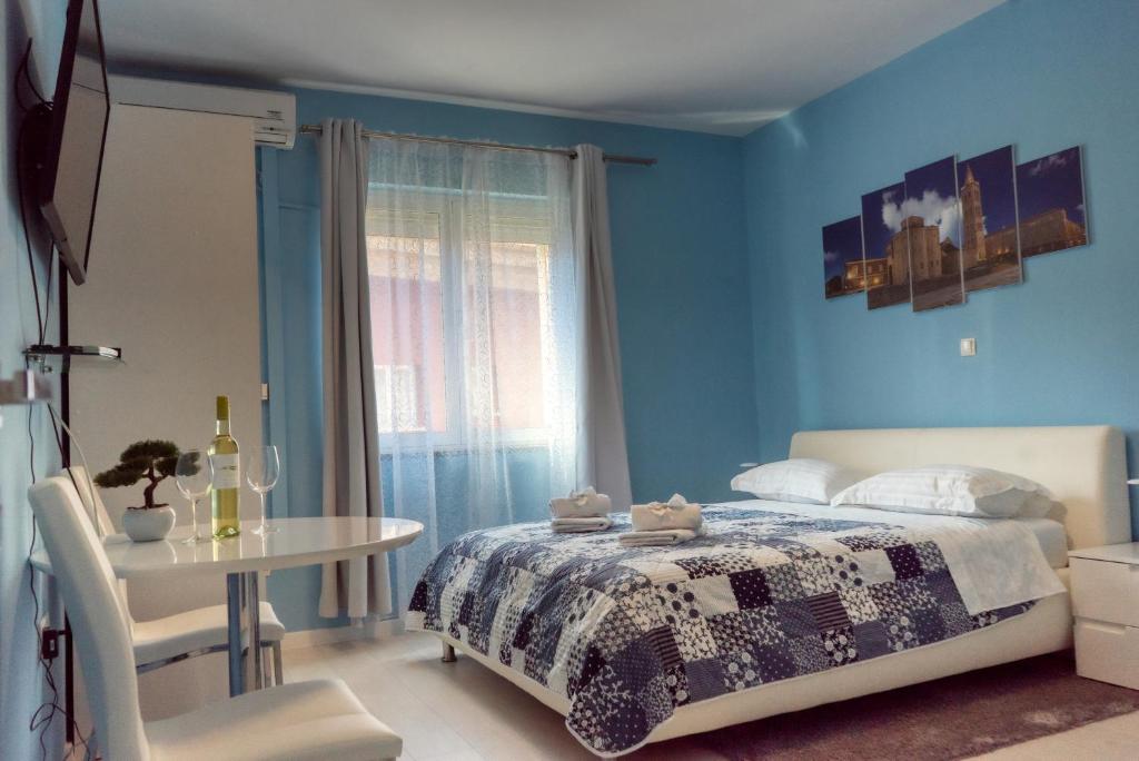 Postel nebo postele na pokoji v ubytování Apartments & Rooms Andrea 2
