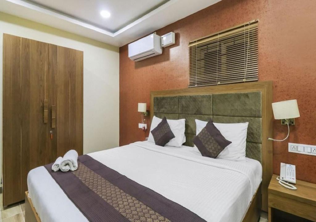 Postel nebo postele na pokoji v ubytování Euphoria Extended Stays - OMR IT Expressway Chennai