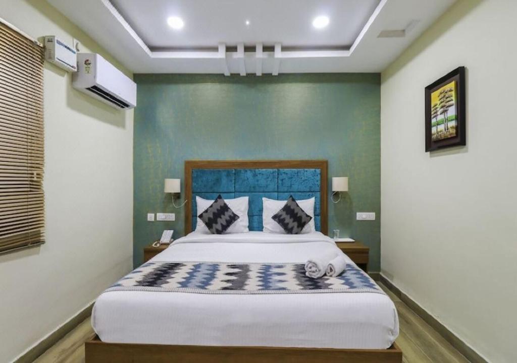 Postel nebo postele na pokoji v ubytování Euphoria Extended Stays - OMR IT Expressway Chennai