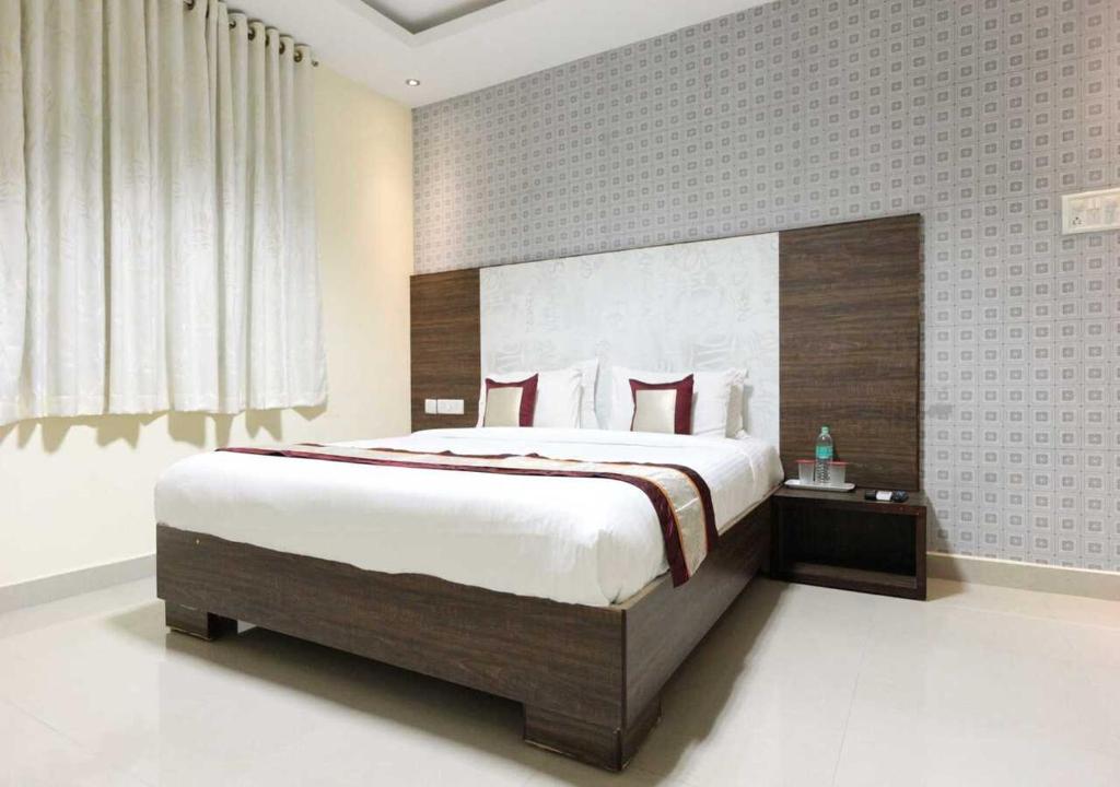 Postel nebo postele na pokoji v ubytování Euphoria Extended Stays - OMR IT Expressway Chennai
