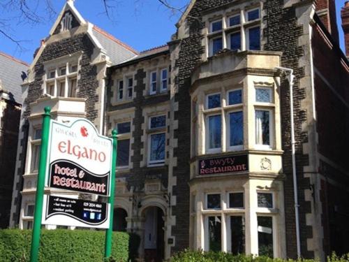 a large building with a sign in front of it at Elgano Guest House in Cardiff