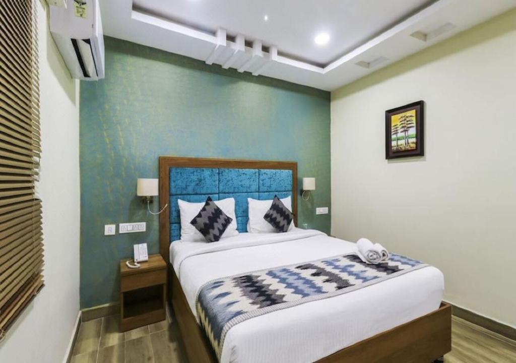 Postel nebo postele na pokoji v ubytování Euphoria Extended Stays - OMR IT Expressway Chennai