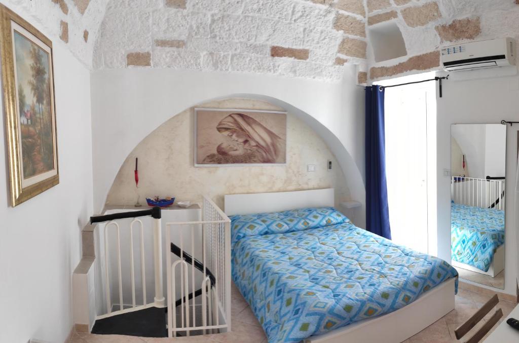 a bedroom with a bed in a room at Casa Marianna Short Lets in Polignano a Mare