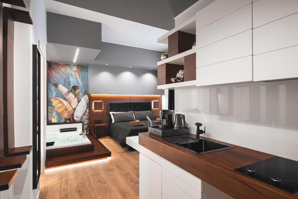 a kitchen and living room with a couch at Residenze Chamur- Grattacielo in Palermo