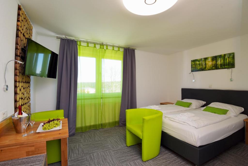 Postel nebo postele na pokoji v ubytování Hotel Zum Gründle