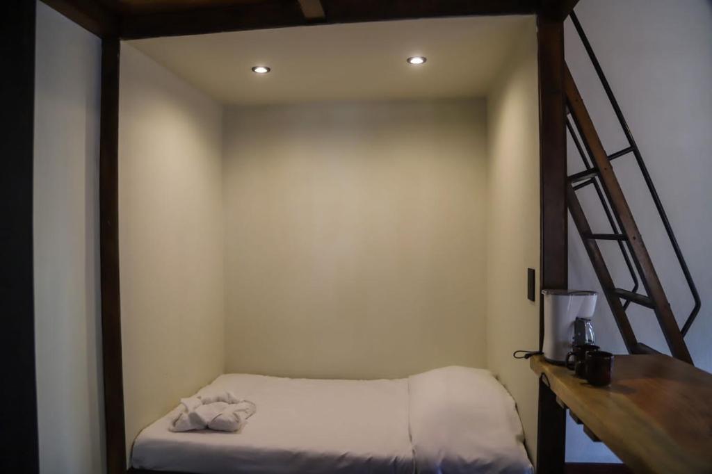 Postel nebo postele na pokoji v ubytování Cotan Ecolodge