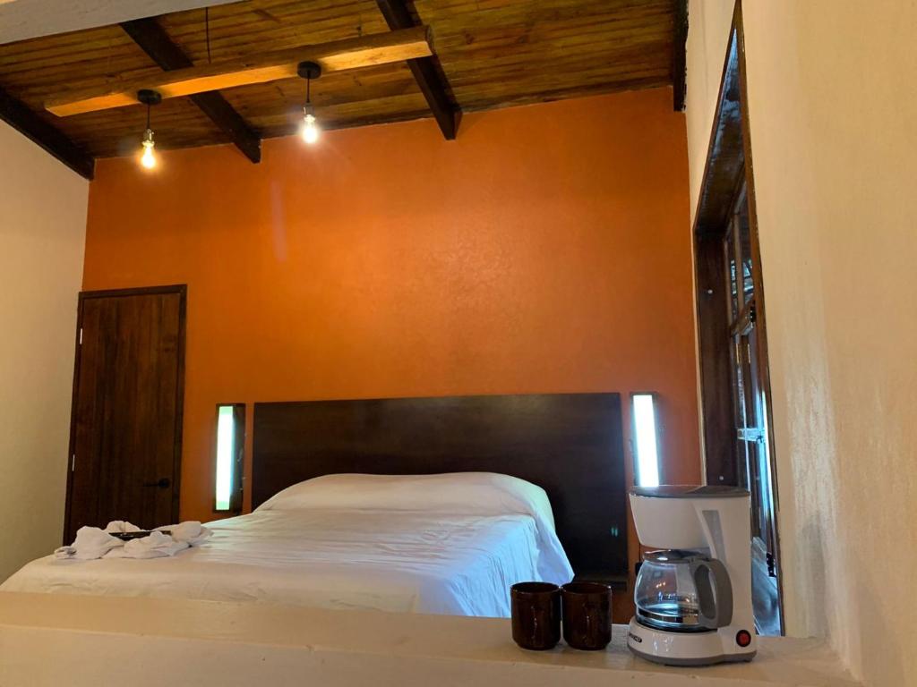 Postel nebo postele na pokoji v ubytování Cotan Ecolodge