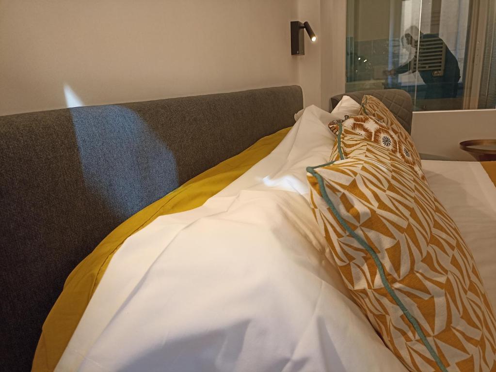 Кровать или кровати в номере Al Porto 61 - Rooms for Rent