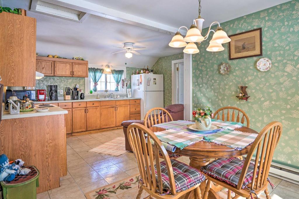 a kitchen and dining room with a table and chairs at Mayville Getaway - Walk to Chautauqua Lake! in Mayville