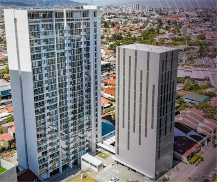 an aerial view of two tall buildings in a city at Ifreses Apartamento 11 in San José