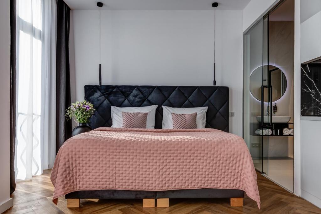 Postel nebo postele na pokoji v ubytování Hotel Central Park
