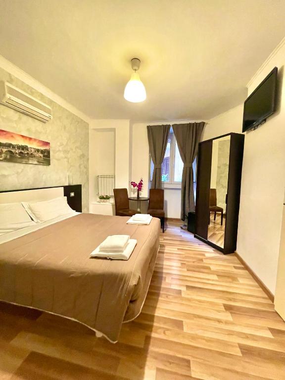 Televízia a/alebo spoločenská miestnosť v ubytovaní B&B A Home in Rome