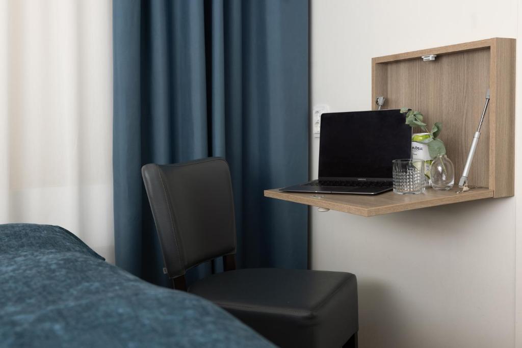 TV a/nebo společenská místnost v ubytování Hotel Söder