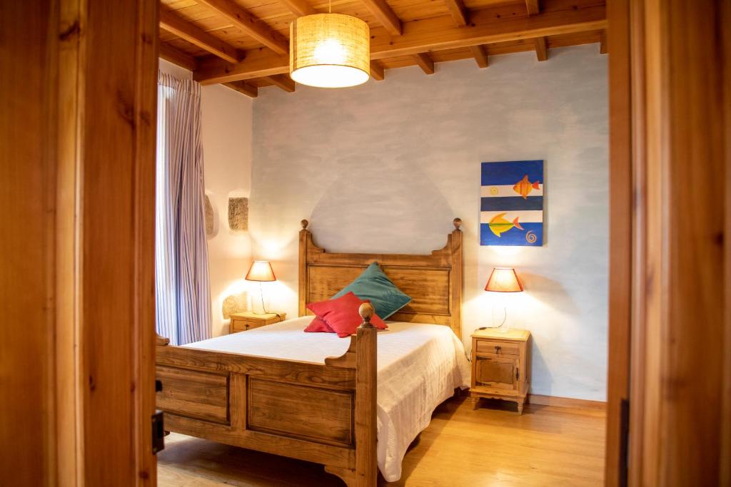 Postel nebo postele na pokoji v ubytování Casa do Plátano