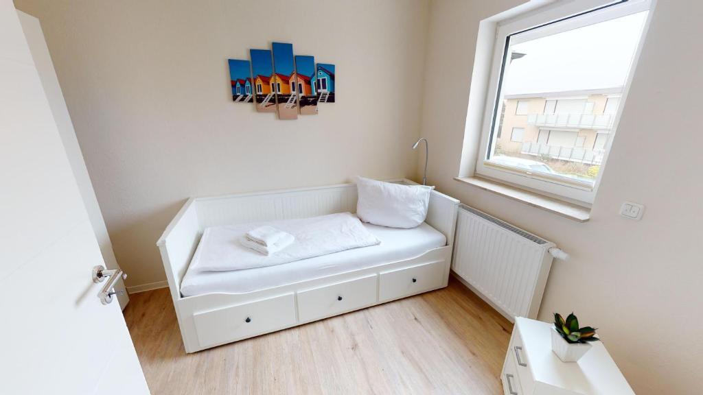 Postel nebo postele na pokoji v ubytování Das Solaris Ferienhaus