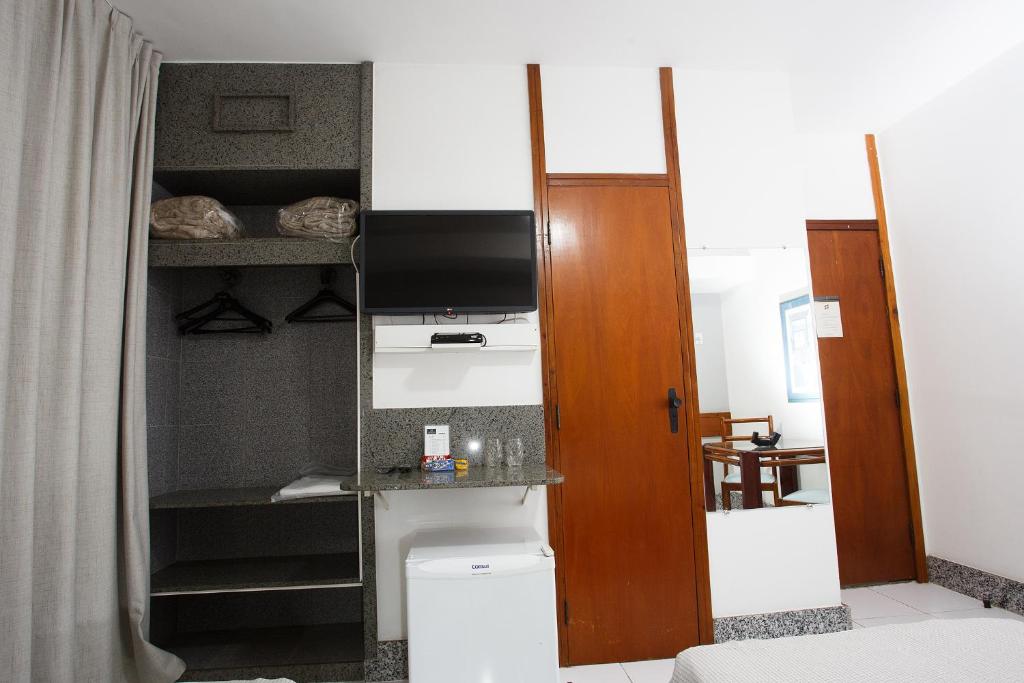 Kuchyň nebo kuchyňský kout v ubytování Savassi Hotel