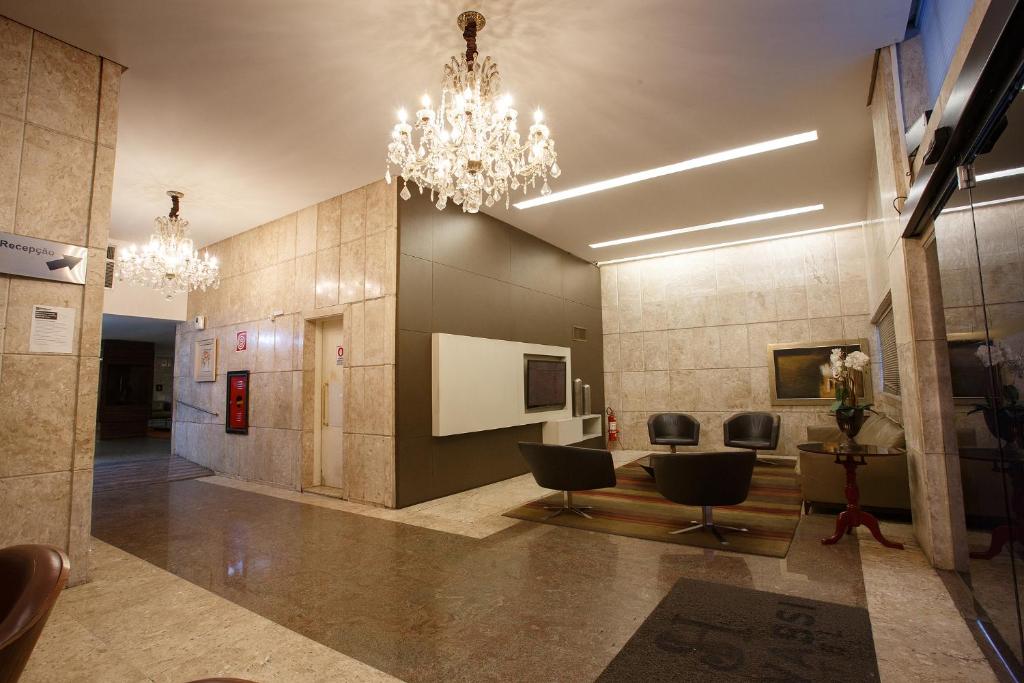 TV a/nebo společenská místnost v ubytování Savassi Hotel
