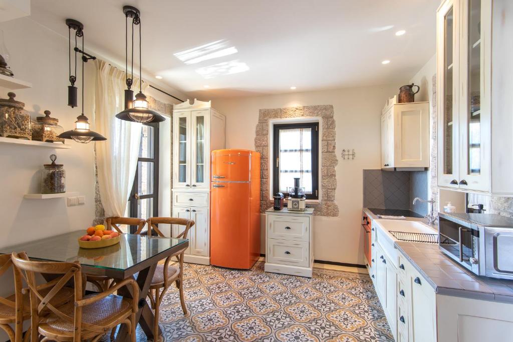 A kitchen or kitchenette at Polismata - Private Residences
