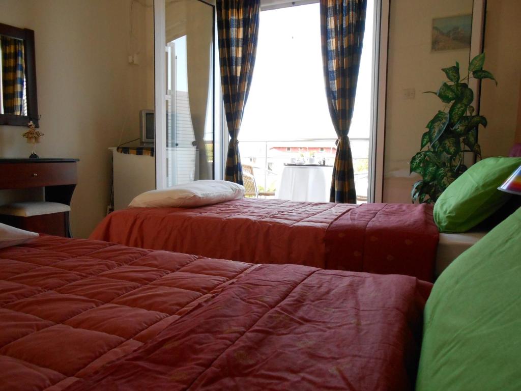 Postel nebo postele na pokoji v ubytování Hotel Neon Astron
